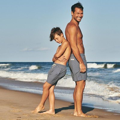 man and son in recycled swimwear